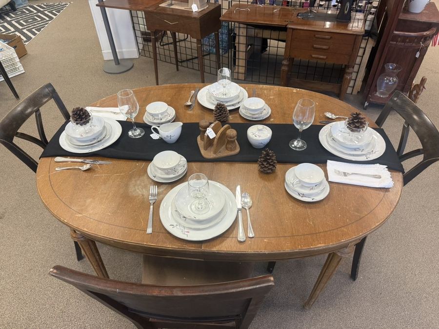 Dining table set with vintage china and glassware at K&A Thrift