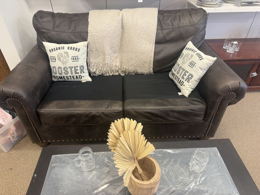 Leather loveseat with farmhouse pillows