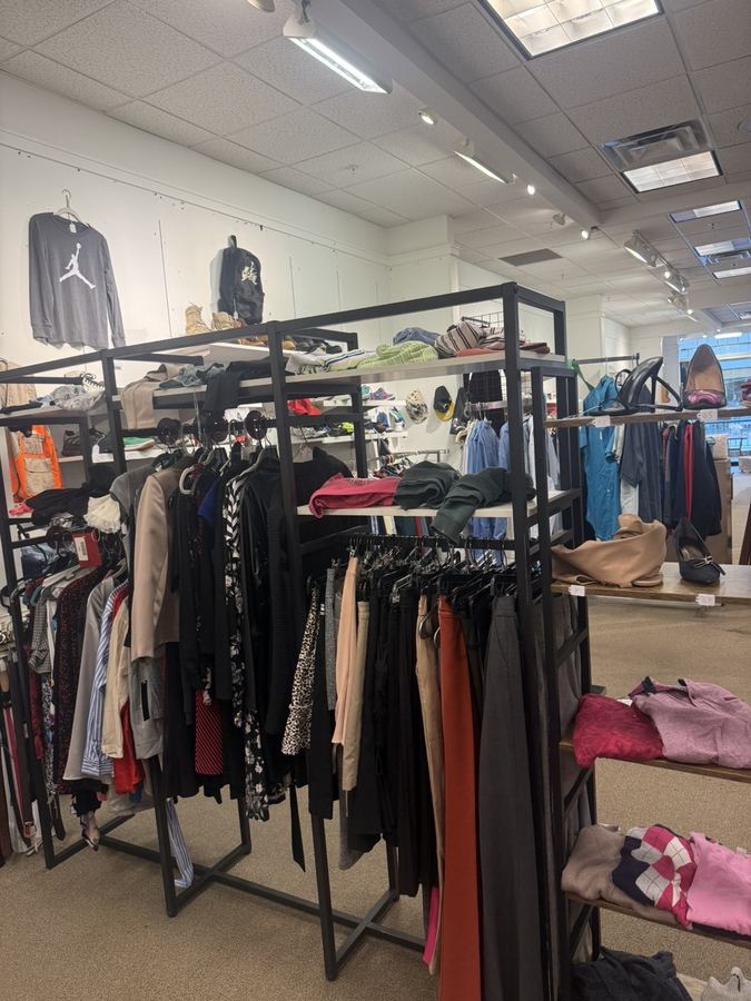 Clothing racks with handbags and accessories at K&A Thrift