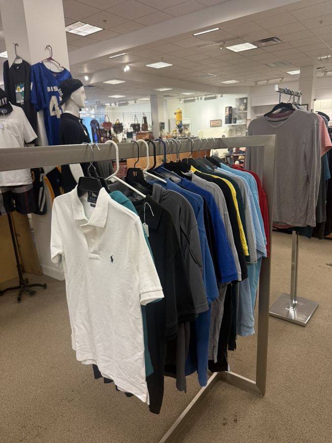 Racks of vintage and modern clothing including a Polo shirt at K&A Thrift